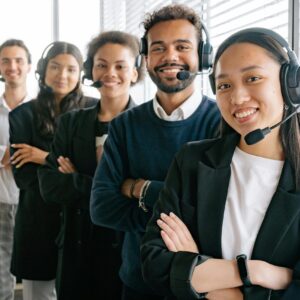 Group of people wearing phone headsets