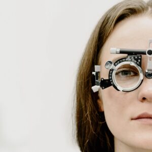 Woman with eye doctor equipment in front of her face