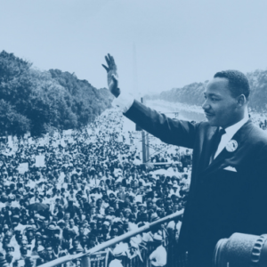 Martin Luther King, Jr. waving to the crowd from the steps of the Lincoln Memorial during the March on Washington.