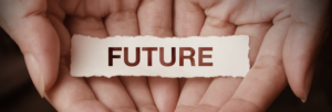 "Future" typed on paper being held by cupped hands