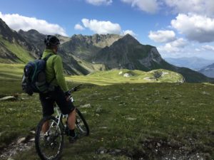 Man riding bicycle on top of mountain photo