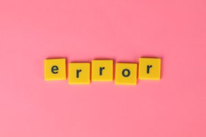 yellow error letter tiles on pink
