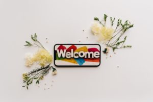 welcome mobile sign with flowers