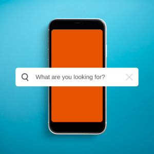 Phone on a blue background with the text "what are you looking for?" in a search bar